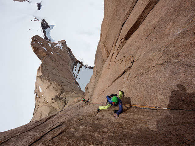 Leo on the stunning corner system high above the ridge on the exposed headwall, attempting to free climb in 20 below.
