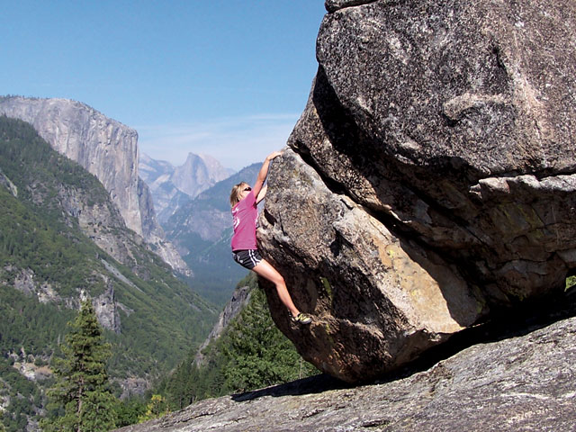 Third Prize:Staci White pulling on the picturesque Turtle Dome Boulder over-looking Yosemite Vally. Photo Andy White. 