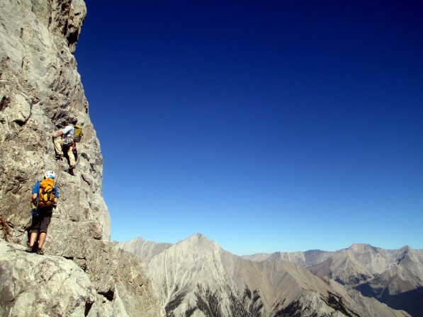 Barry Blanchard leading a client on Mt. Louis on a hot September day