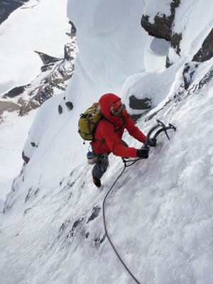 Climbing Big Alpine Routes in the Canadian Rockies. Josh Wharton following a pitch in the upper gully section of Infinite Patience. Sustained grade 3 and mixed up to M5 for at least 300 m 