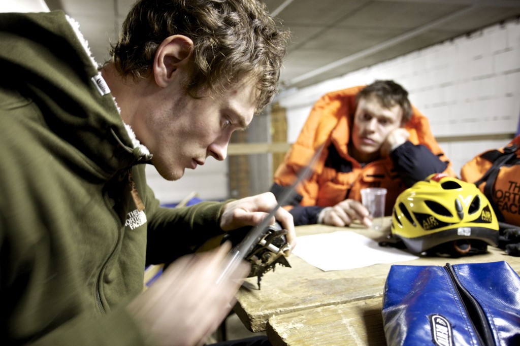Maxim Tomilov helps sharpen the crampons of his brother Alexey Tomilov in Saas Fee Photo UIAA