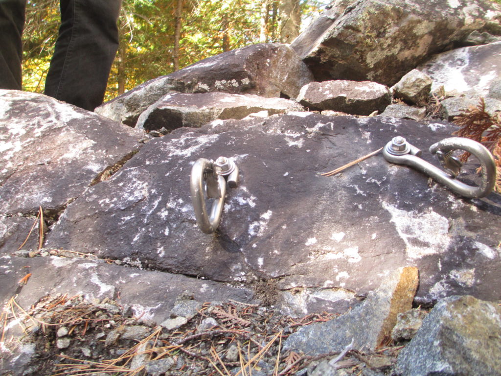 This anchor was once 30 metres up a wall, but freeze/thaw shattered the cliff, sending down three eight-bolt routes.