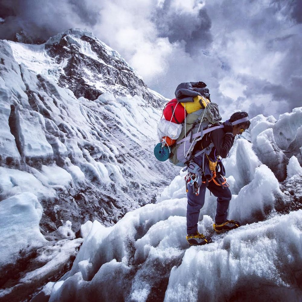 Photo by Aaron Huey: A climbing Sherpa returns down the Khumbu Ice Fall after gathering the last gear at Camp 2 on Mt Everest in the final days of the 2013 season. Shot on assignment for National Geographic magazine.