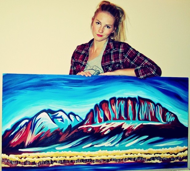 Kayla Eykelboom with her painting of Yamnuska