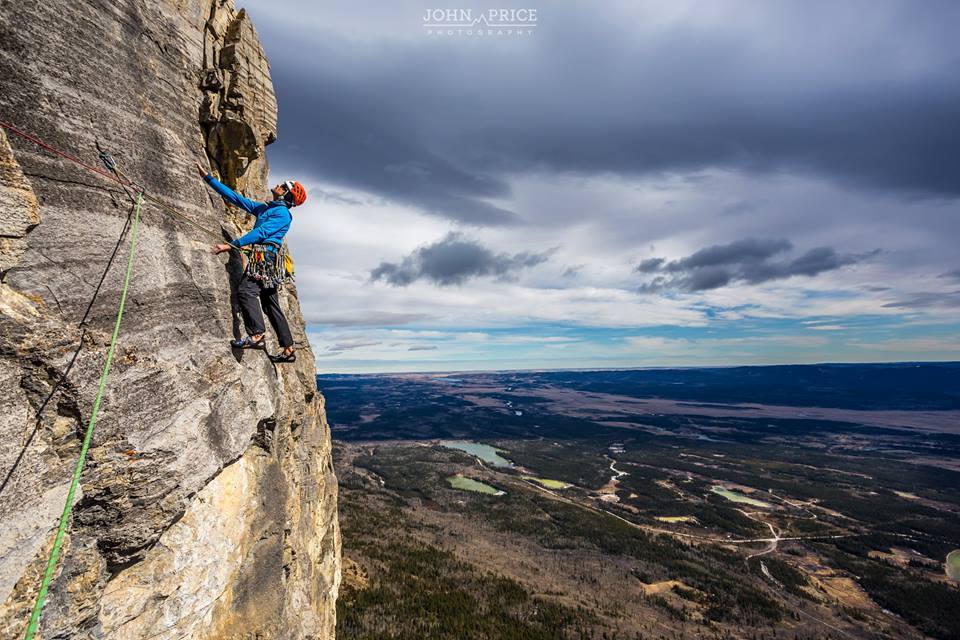Jon Effa making his way across the classic last pitch traverse of Red Shirt on Yamnuska. Photo taken by John Price who owns and operates John Price Photography. Check out his Facebook page here.