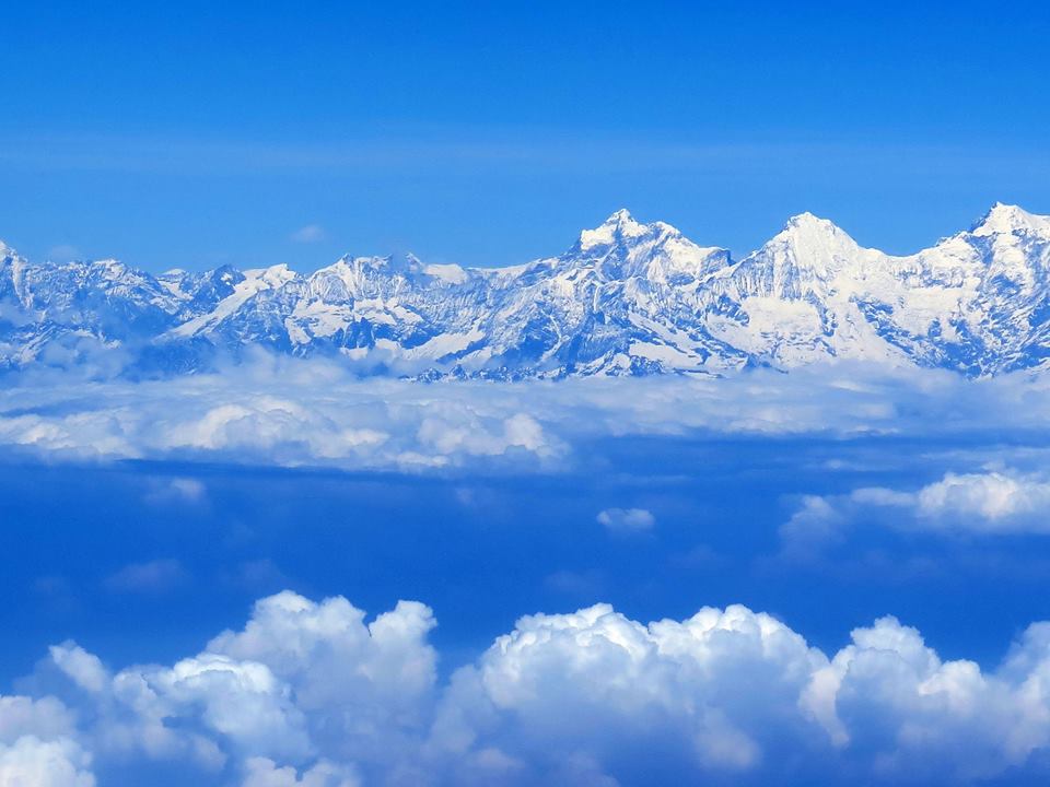 "Approaching Kathmandu, the plane banked hard to the left, the clouds dropped below, and the high Himalayas appeared. Deep in my bones, I feel the mountains calling."  Photo Jim Davidson