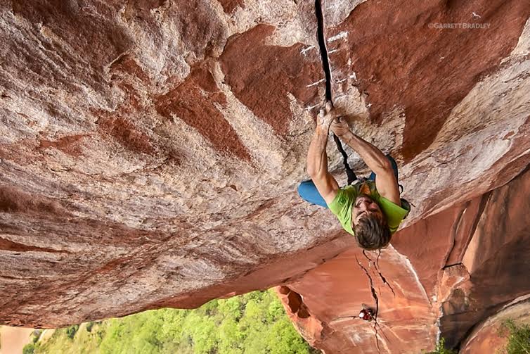Logan Barber crushed the 30-degree overhanging ring lock crux on the The Firewall in Liming China. Photo Image is Copyright Garrett Bradley. All rights reserved. No use, duplication or adaptation allowed without written permission.