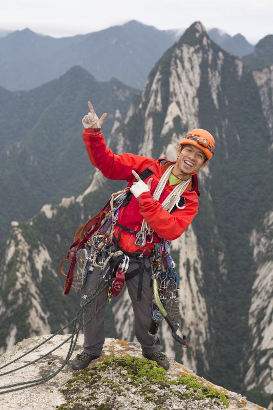A happy He Chuan on the summit of Mount Huashan.  Photo Rocker Wang