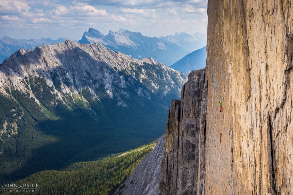 Sonnie Trotter high on his and Tommy Caldwell's route The Shining 5.13+ on Mount Louis. The Shining takes the line of weakness up this steep, ledge-less wall. Other lines await to be climbed, is this where the future of Canadian alpine sport climbing will take place? Photo John Price Photography