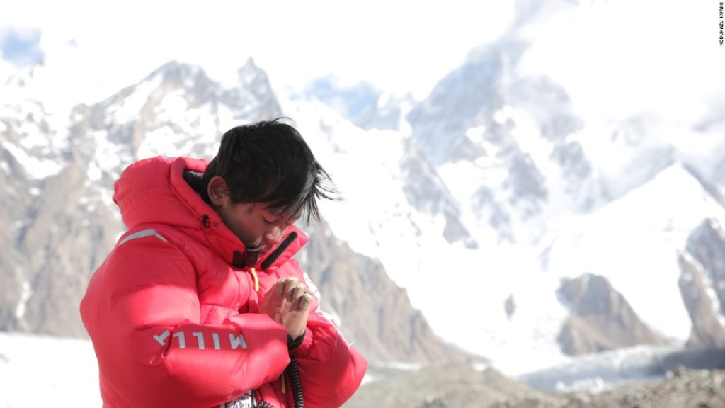 Kuriki clasps his hands en route to Everest, which were badly frostbitten in 2012 and required amputation of several fingers. 