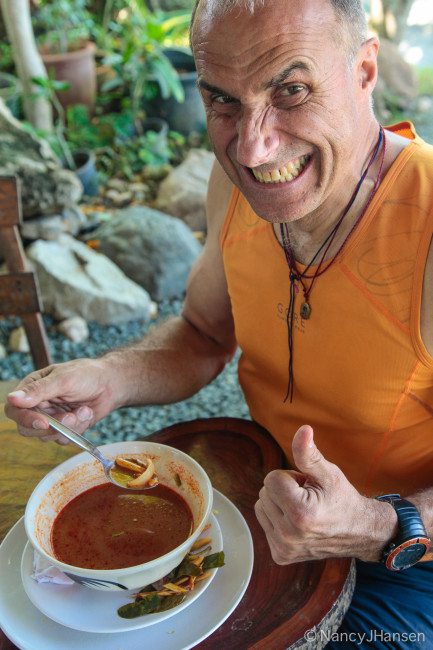 "Here is Ralf, 'enjoying' an extraordinarily spicy soup. An occasional meal was so hot that my mouth swelled up and I could no longer speak because of the pain." Photo Nancy Hansen