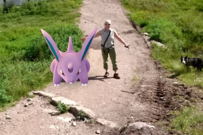 Mountain safety adviser heather Morning with a Pokémon Go character in the Cairngorms. Source BBC