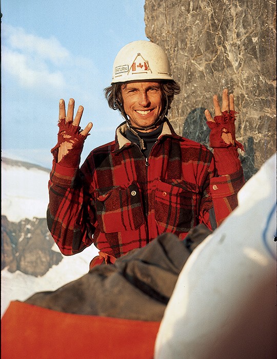 David Cheesmond is all smiles as he shows off his worn crack gloves on the first ascent of the North Pilla in 1985. Photo Barry Blanchard