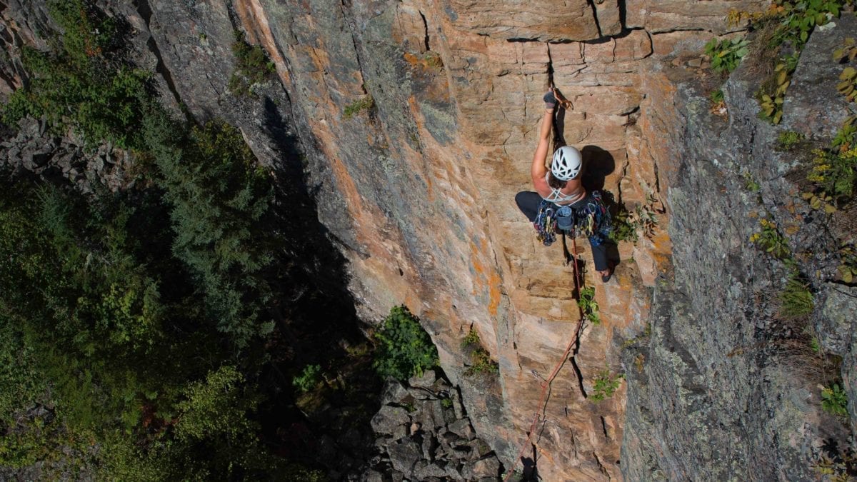 Rock climber uses crack gloves