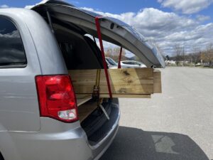 Wooden planks in the back of a mini van